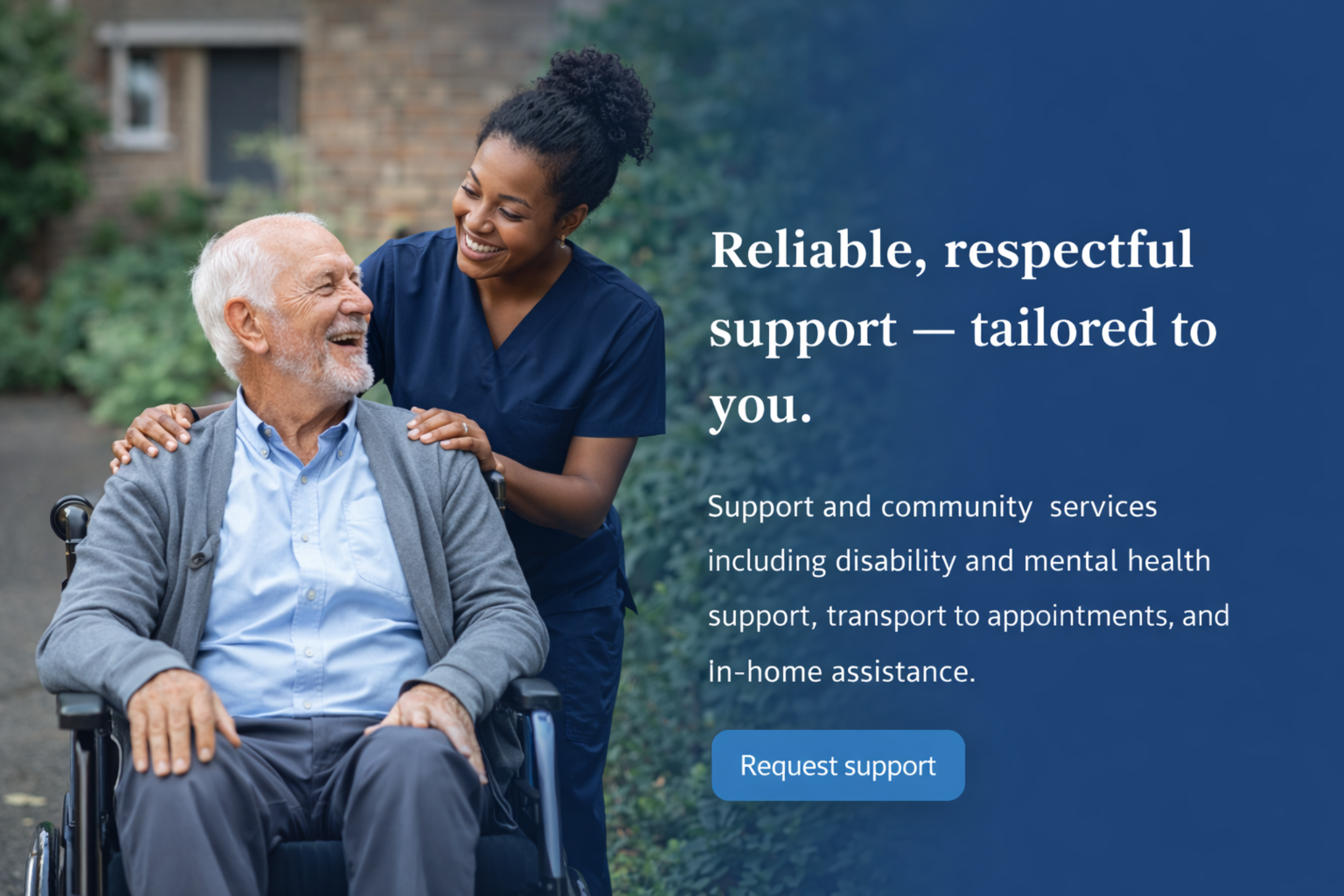Support worker assisting an older person in a wheelchair outdoors.