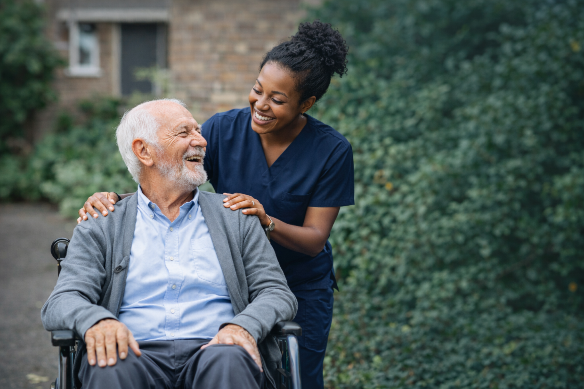 Support worker assisting a client indoors.